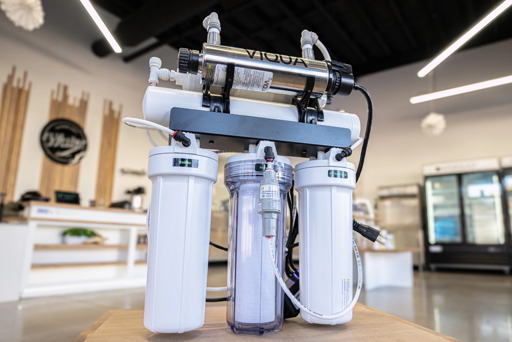 Best water filtration system for home use featuring a multi-stage residential water filtration unit with filter cartridges and stainless steel components at Hydrology Water Store